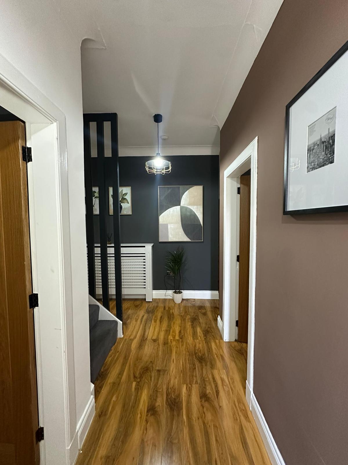 Wood-effect flooring running through a hallway